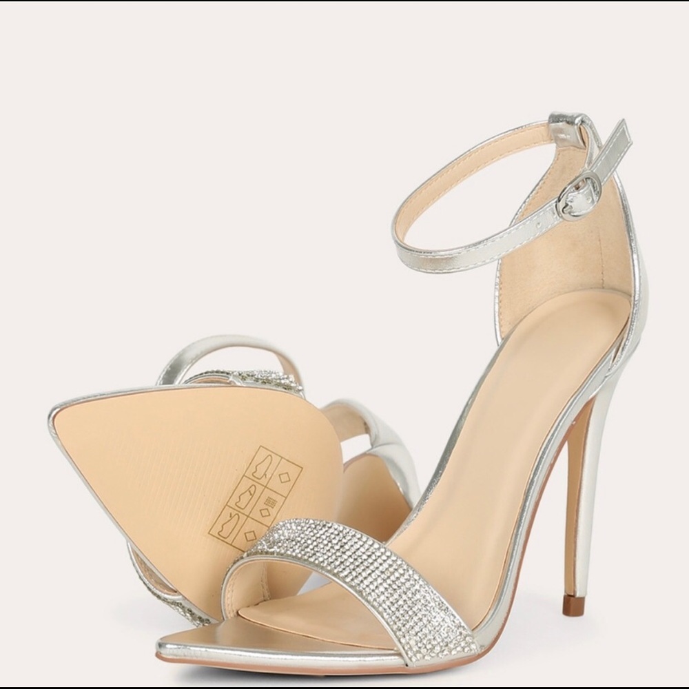 Silver pointed toe stiletto heels.